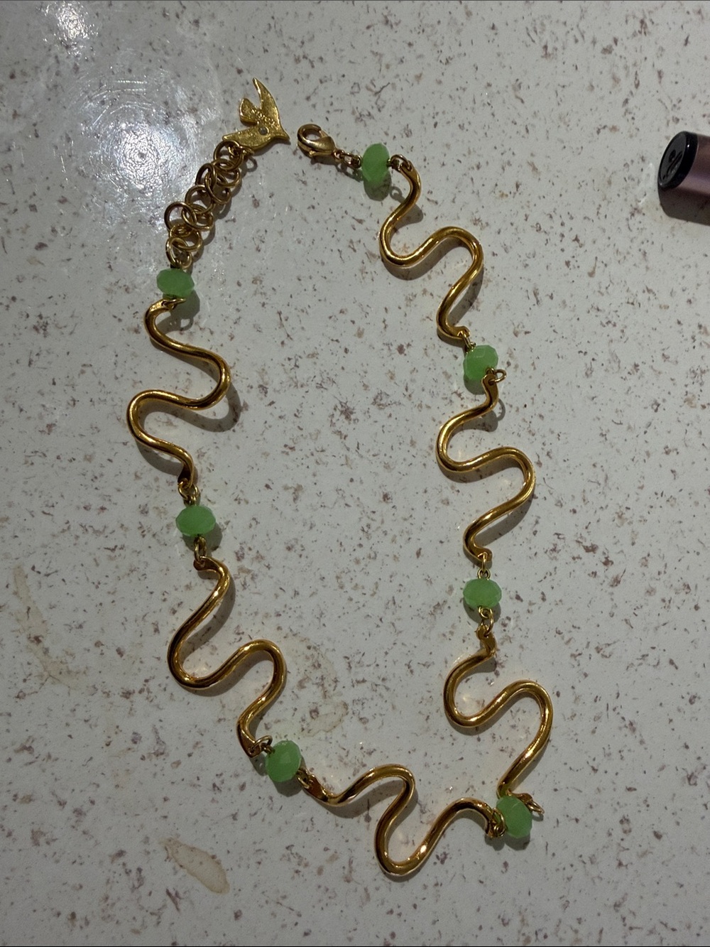 Gold Wave-Link Necklace with Light Green Bead Accents